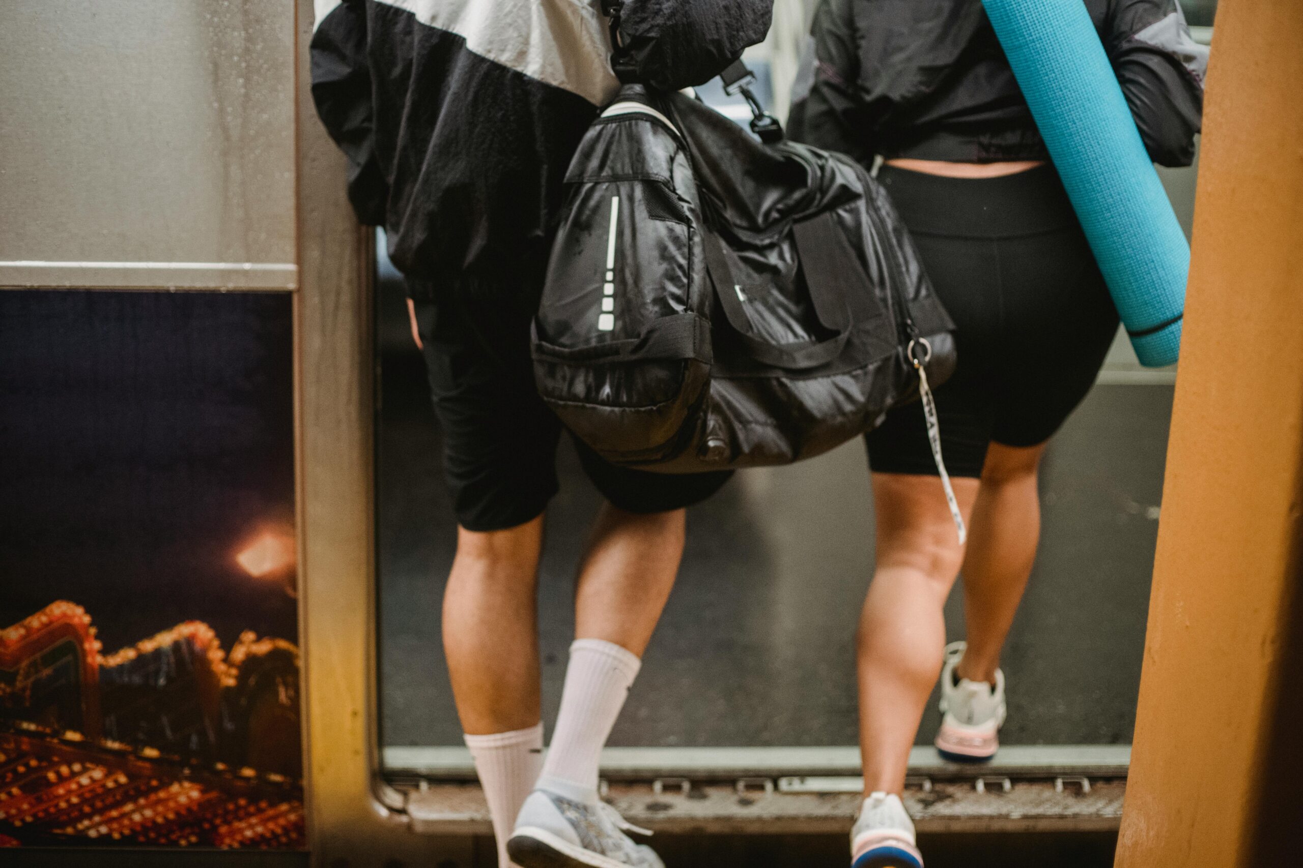 Back View of Man and Woman with Luggage